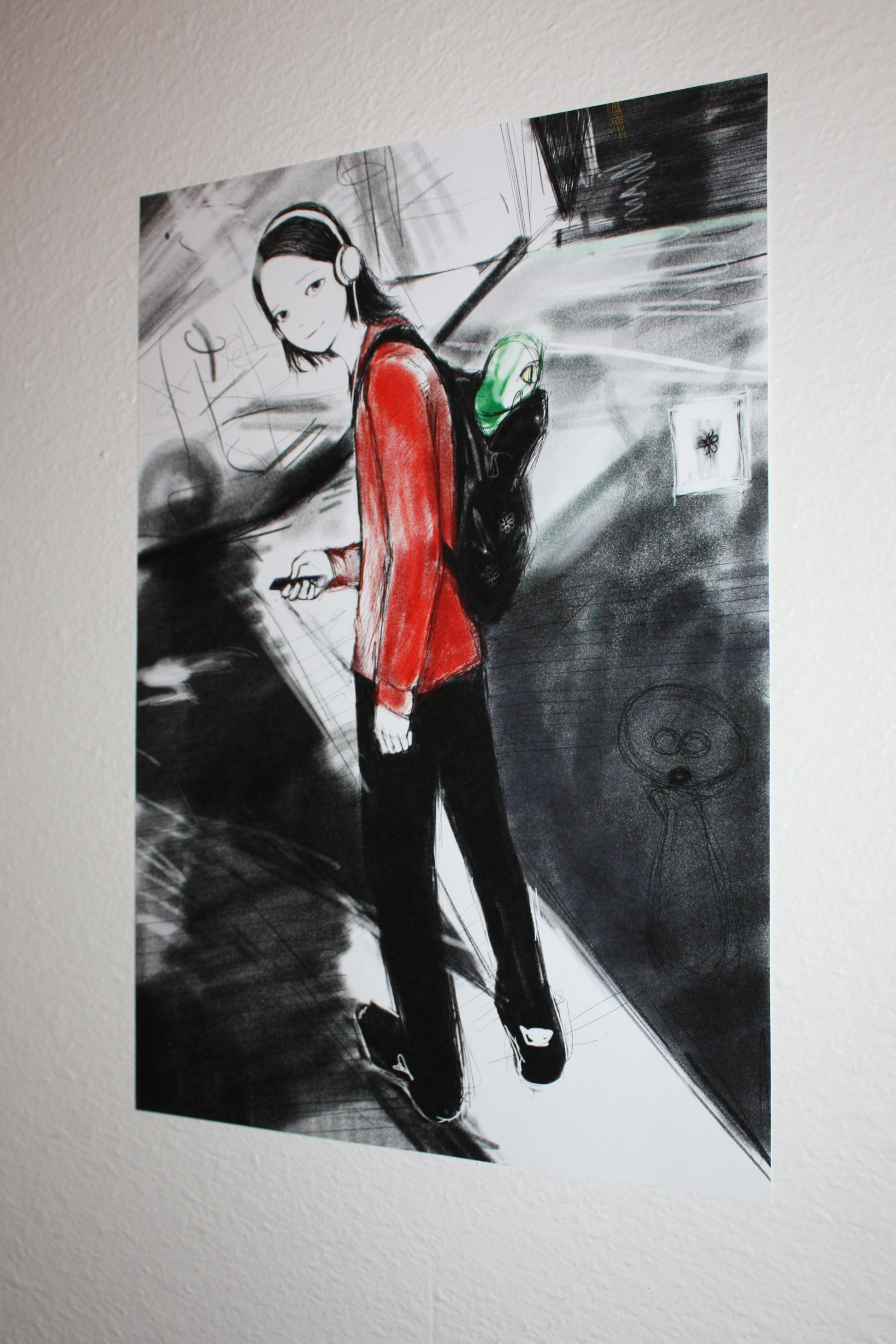 Detail of an anime guy looking back at a camera on a white wall